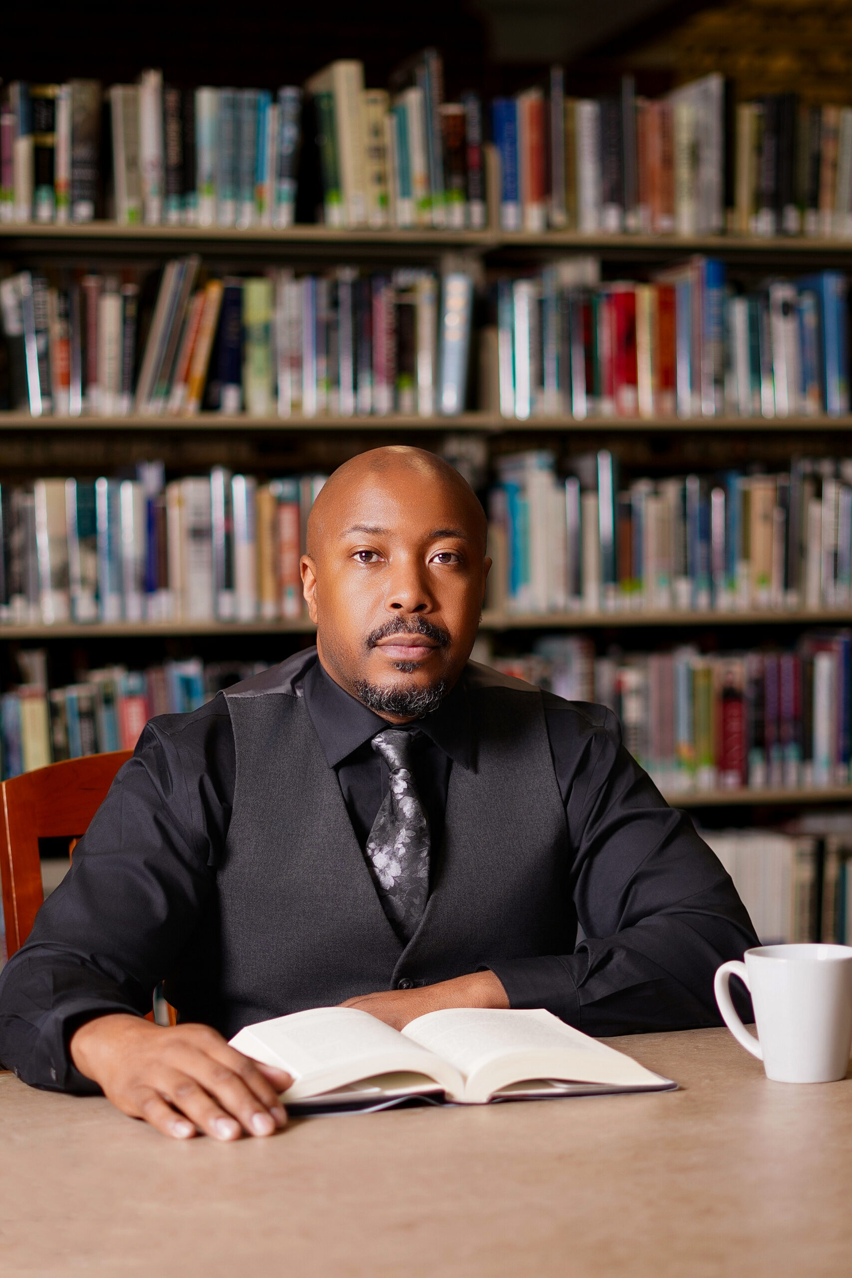 Jerome McNeary at a study table with an open book
