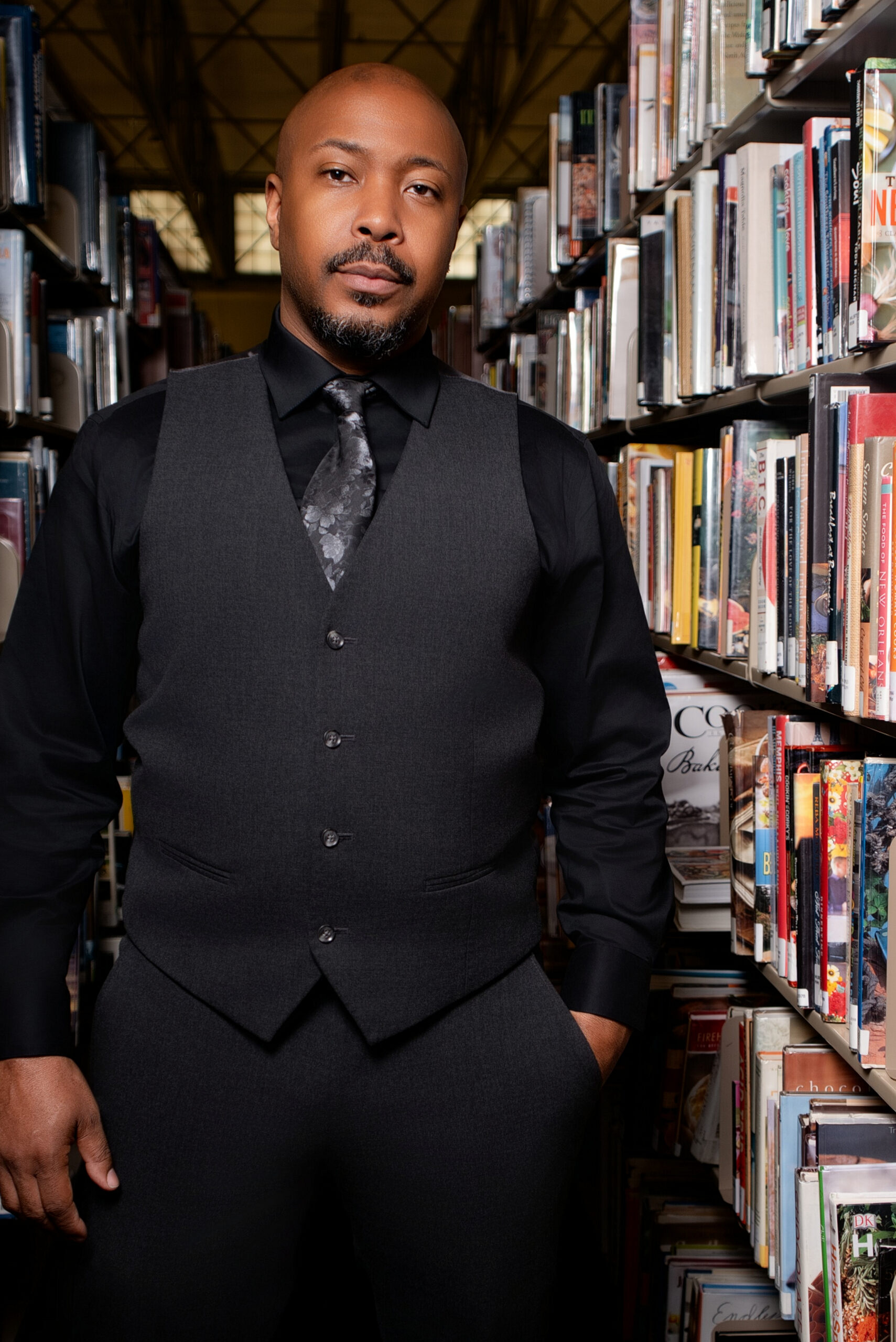 Jerome McNeary among library shelves